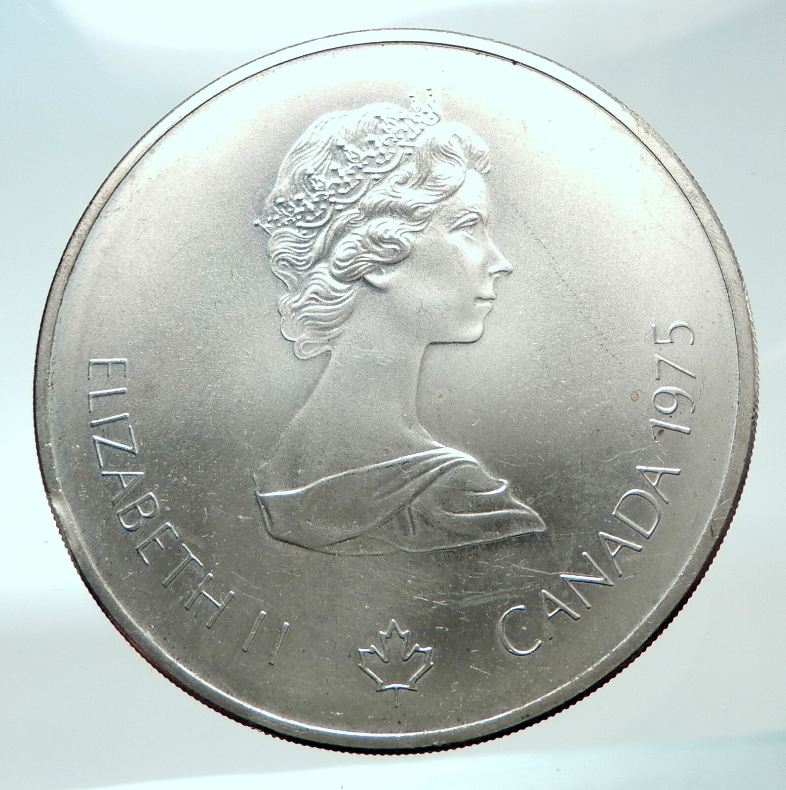 1975 CANADA Queen Elizabeth II Olympics Montreal Rings Silver $10 Coin i82138