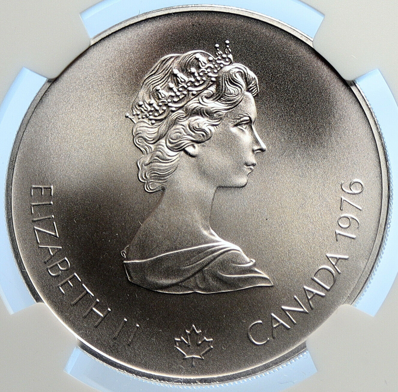 1976 CANADA UK Elizabeth II Olympics Montreal Village Silver $5 Coin NGC i106458